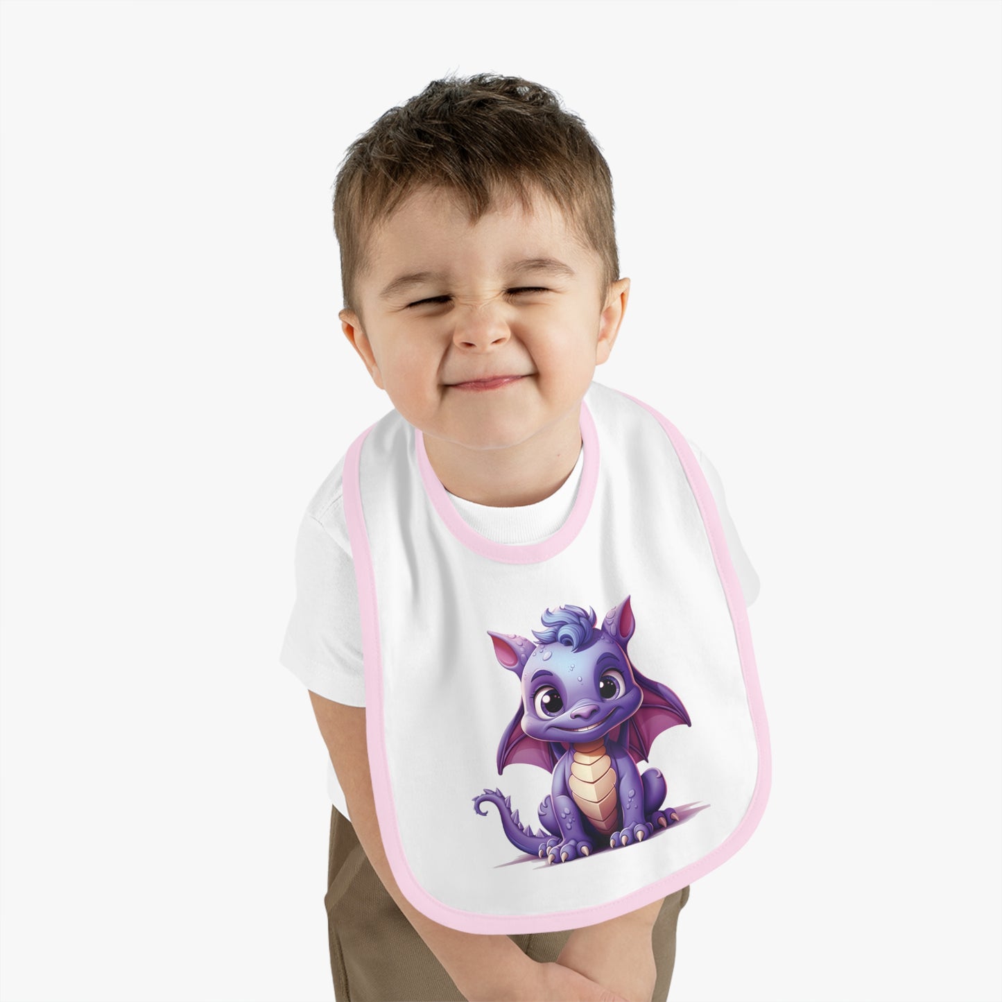 A white 100% cotton baby bib trimmed in pink - with a purple baby Happy dragon in the center - a large bib super cute.