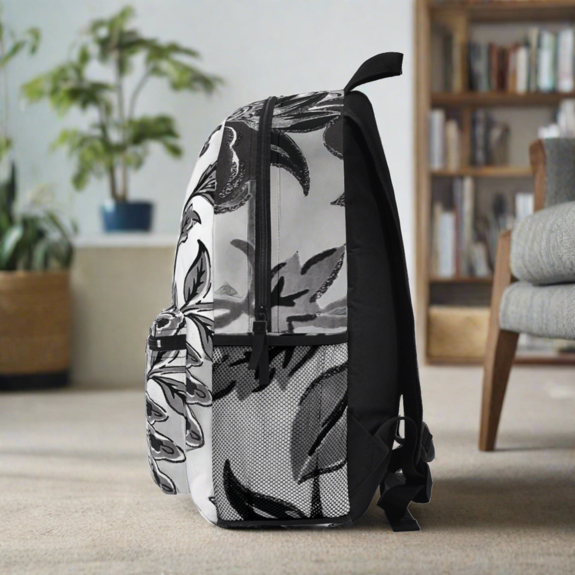 Black & white flowers are all over printed bold & clear into the durable canvas material ... beautiful and sturdy backpack with compartments and zippered front pocket - flowered decorative black & white pattern for retro lovers.