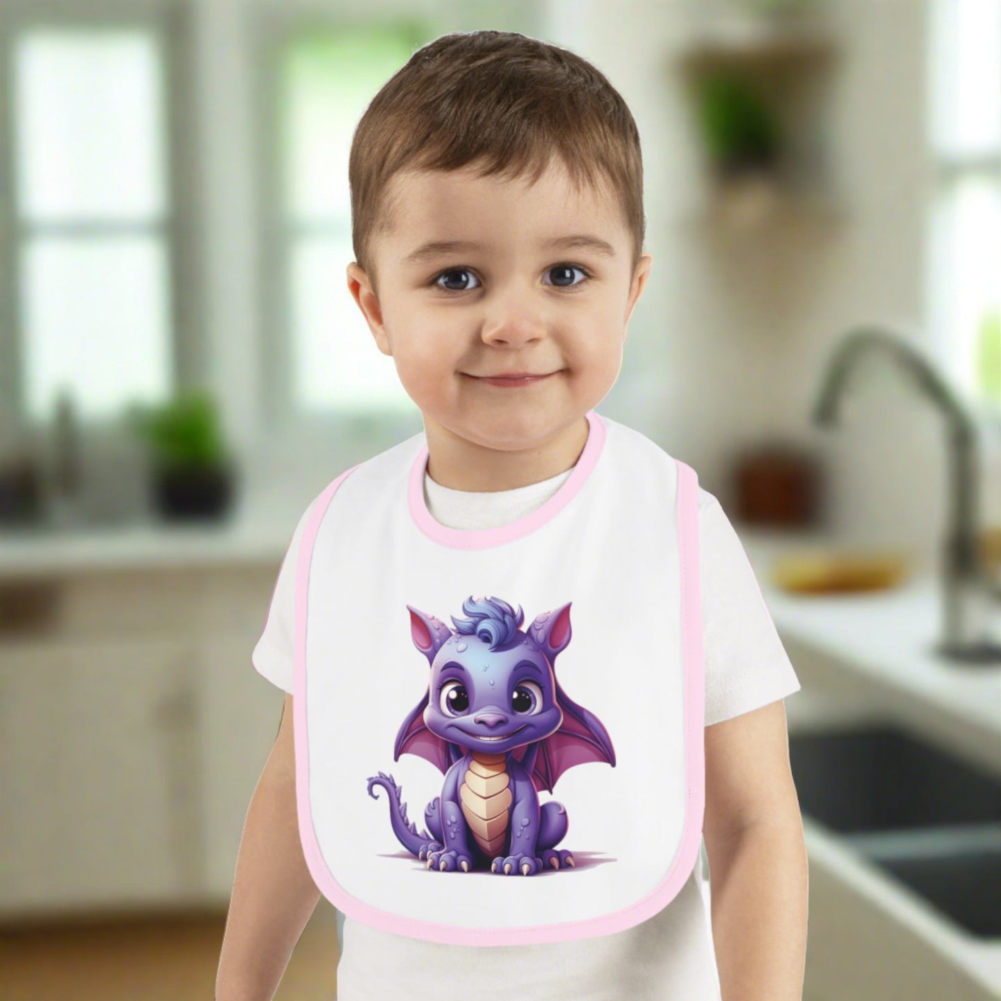 A white 100% cotton baby bib trimmed in pink - with a purple baby Happy dragon in the center - a large bib super cute.