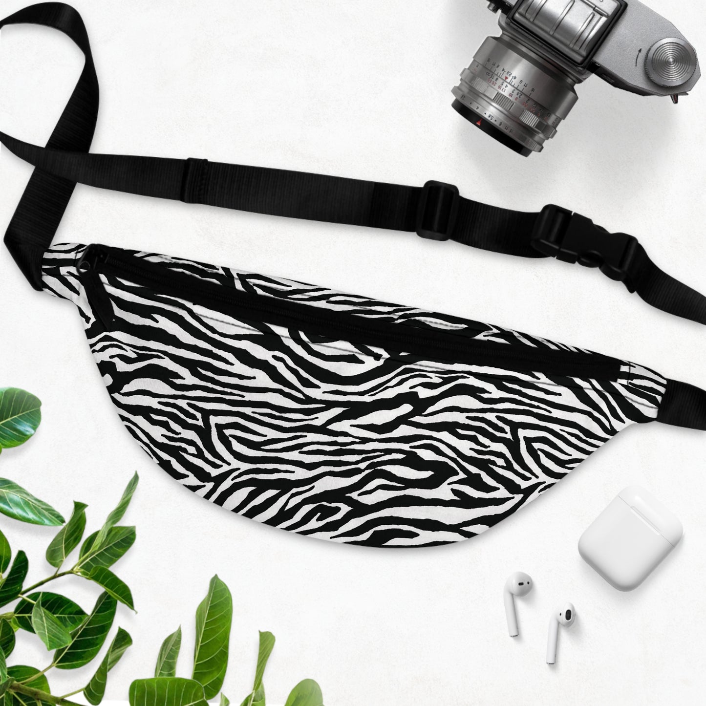 Our zebra animal print anti theft fanny pack bag is perfect for traveling as well as errands - inside a net divides a generous compartment with a zippered pocket and 3 cc slots - outside is another smaller zippered pocket for quick access - a large sturdy black zipper is along the top of the bag - a black back - easy to clean material and bright high quality print. 