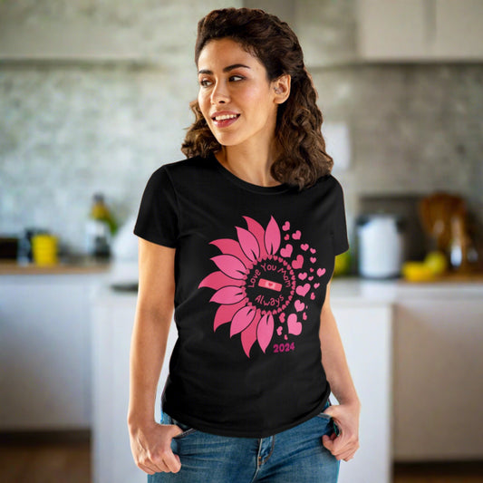 a pink sunflower - half of it is hearts as petals - 2024 - with Love You Mom Always is the message with a pink bandaid with a pink heart in it on a short sleeve semi fitted tee