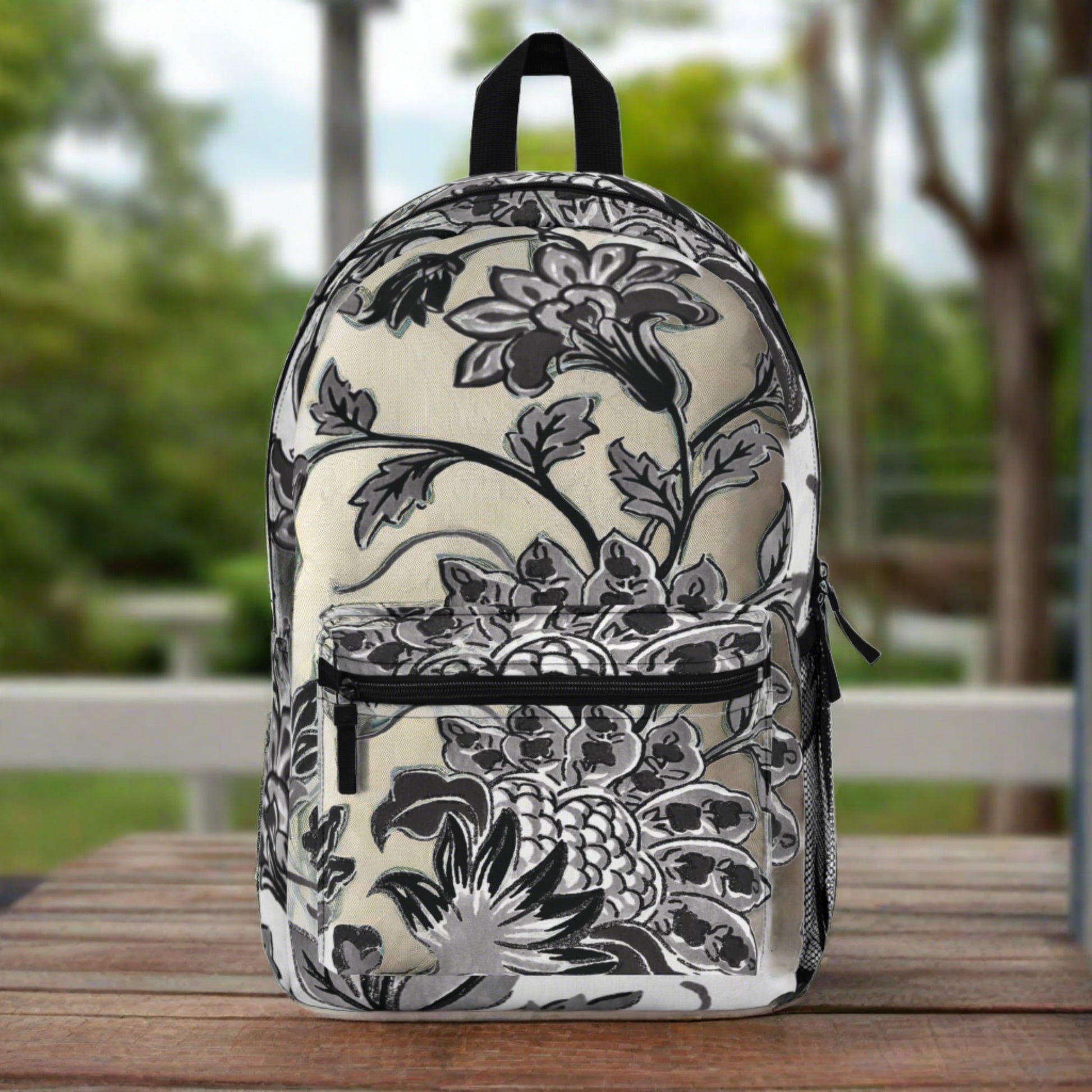 Black & white flowers are all over printed bold & clear into the durable canvas material ... beautiful and sturdy backpack with compartments and zippered front pocket - flowered decorative black & white pattern for retro lovers.