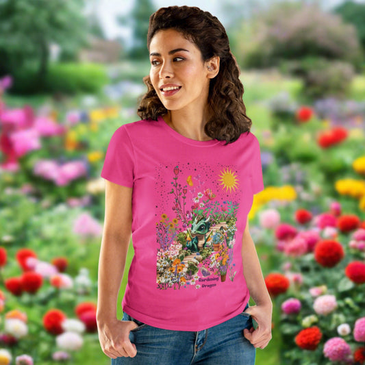 a green baby dragon sits in her flower garden with butterflies Gardening Dragon is the text on the short sleeve tee semi fitted