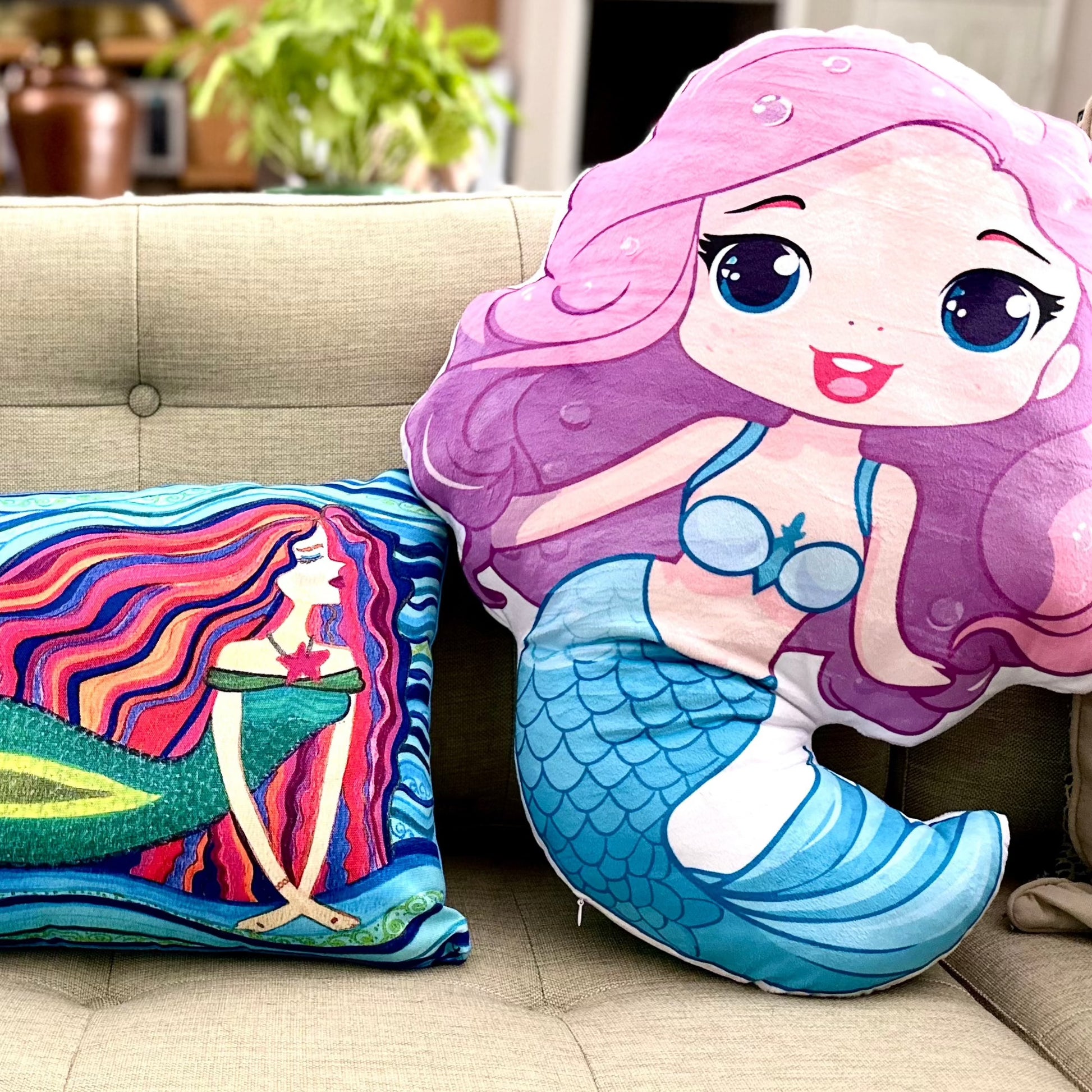Suzie mermaid girl is wearing a light blue skirt/tail and top - pink long swingy hair and blue big sweet eyes - a cuddle-buddy pillow doll in 4 sizes up to 28 inches tall - minky soft and comforting to cuddle - small is perfect for traveling as a comfort-buddy that will start conversations yes! So fun!