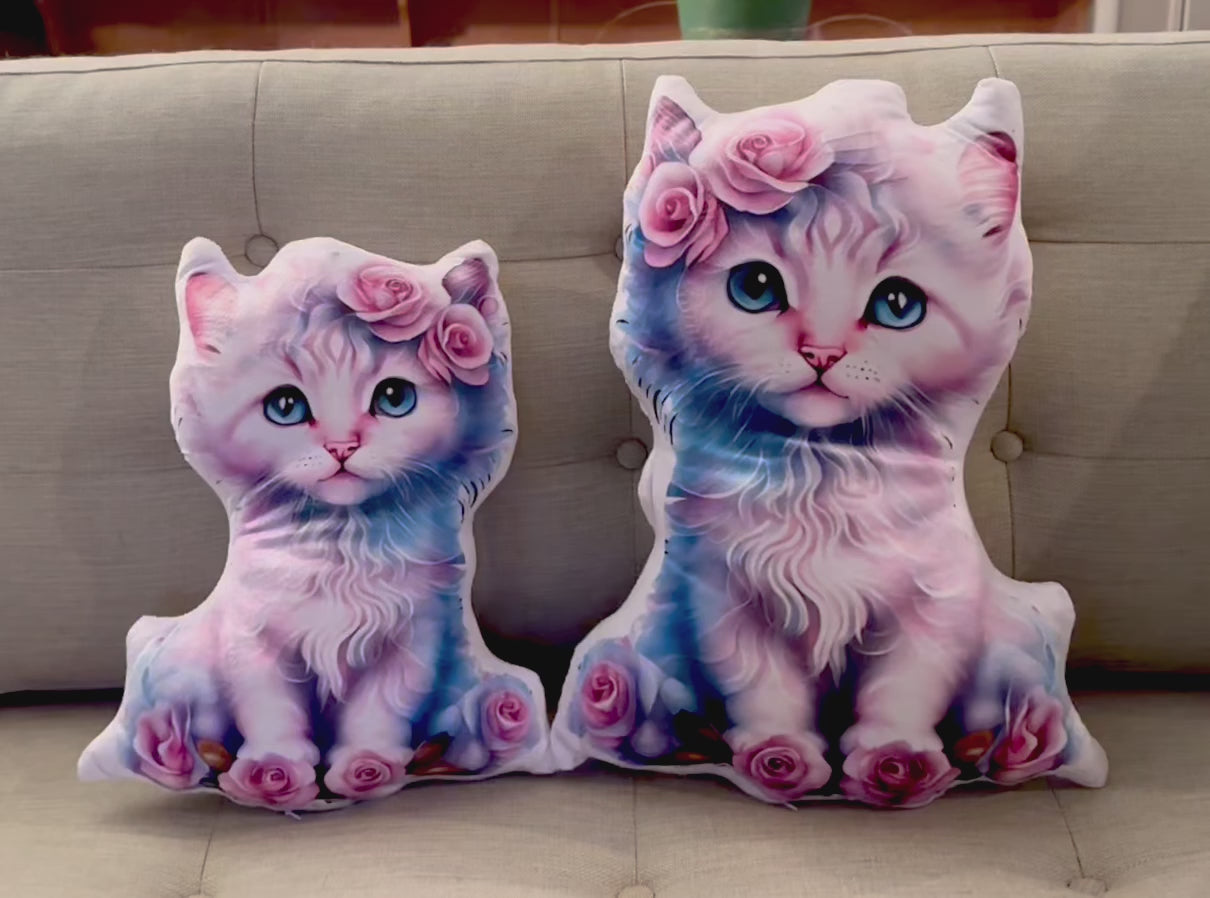 Load video: Mimi Rose pink cuddle-buddy Kitty is adorable and fluffy - roses above her bright blue eyes and at her paws - she is looking right at you with her sweet blue eyes - she is made of minky soft velveteen fabric - in 4 sizes up to 28 inches! Small &amp; Medium shown here with 25 pound Sammy Cat!